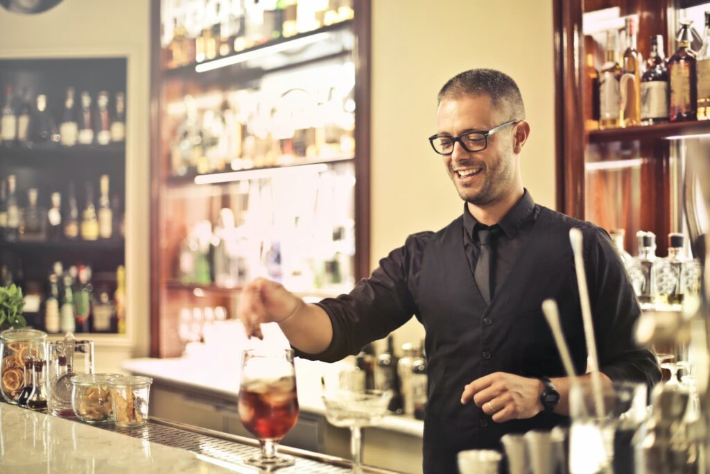 A bartender working at a bar